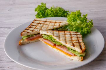 Club sandwich on wooden table