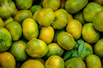 Fresh yellow tangerines for sale at the local farm market