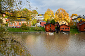 Fototapeta na wymiar Beautiful autumn view of the river and the old town. Porvoo, Finland.