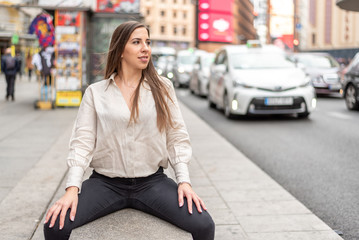 Girl sitting on a street bench