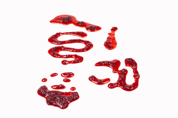 Red jam splashes isolated on white