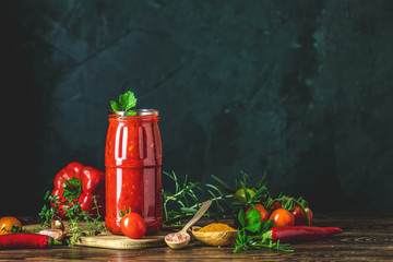 Homemade DIY natural canned hot tomato sauce chutney with chilli or adjika