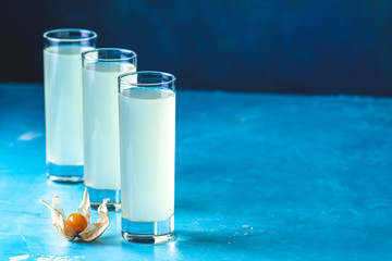 Alcoholic cocktail with Ouzo greek anise brandy or Arabic alcohol drink Raki in highball glass