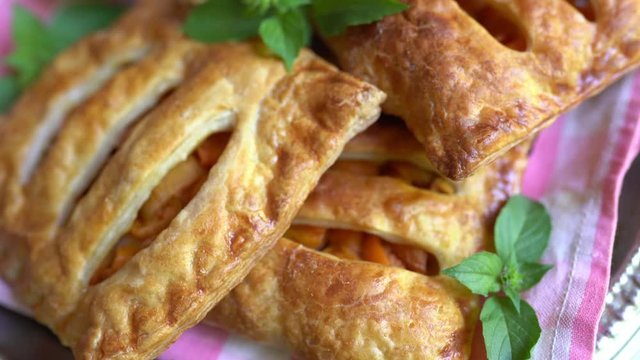 Freshly baked puff pastry with mint close up