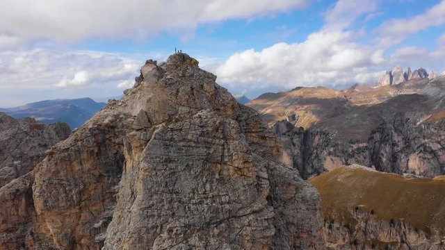 Aerial view of the Paso Gardena Pass in the province of Bolzano. Dolomites. Flying near the Pizes de Cir. In the distant view of a mountain Schelrn. Autumn in Italy