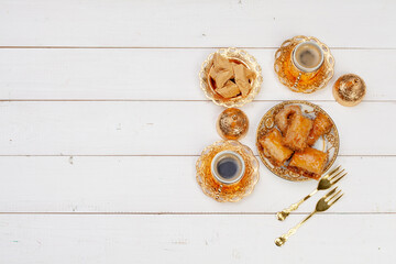 Cup of hot tea and a plate of turkish desserts