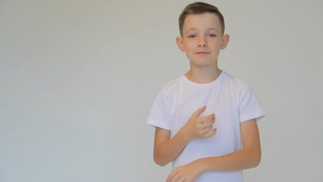 Disappointed boy in white t-shirt waving arms on white background.