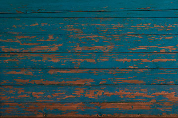 Fototapeta na wymiar Blue and orange old wooden texture background. Scratched weathered wooden wall close up