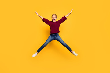 Fototapeta na wymiar Full length body size photo of cheerful screaming overjoyed girl shaping star with legs arms jumping isolated vivid color background