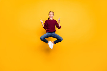 Fototapeta na wymiar Full length body size view of her she nice attractive girlish cheerful cheery pre-teen girl jumping showing om sign zero gravity isolated on bright vivid shine vibrant yellow color background