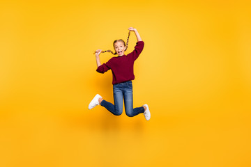 Fototapeta na wymiar Full length body size view of nice attractive overjoyed cheerful cheery foolish playful pre-teen girl having fun jumping isolated on bright vivid shine vibrant yellow color background