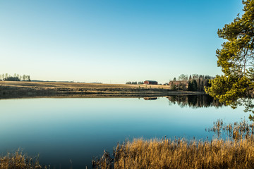 Fototapeta premium Beautiful autumn landscape of Kymijoki river waters at sunset. Finland, Kymenlaakso, Kouvola