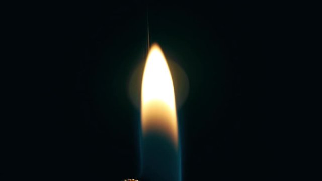 Lighter Flame at night on a table