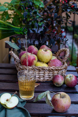 Organic apple juice with fresh ripe apples