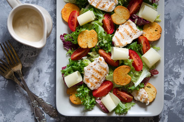 Caesar salad with croutons cheese and chicken