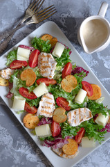 Caesar salad with croutons cheese and chicken