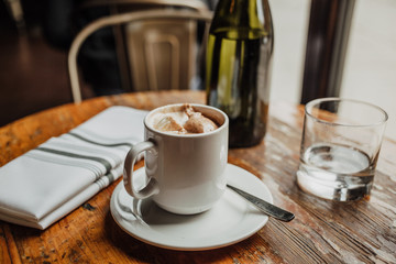 Cup of hot chocolate on wooden table
