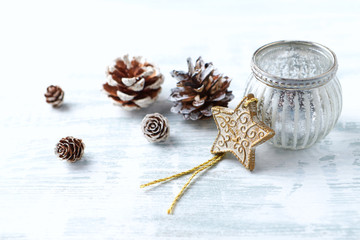 Christmas ornament (wooden Christmas Star) on bright wooden background. Close up. Copy space. 