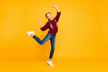 Fototapeta na wymiar Full length body size view of nice attractive lovely playful cheerful cheery foolish pre-teen girl having fun fooling isolated over bright vivid shine vibrant yellow color background