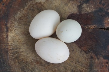 Duck eggs, high angle photography Pasted on an old wooden background Ready for cooking