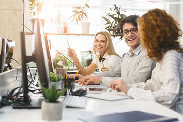 Professional agents discussing new business strategy in office