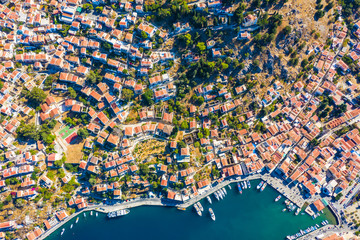 incredible view from the drone of the Bay and the houses of the Greek island. colorful houses, yachts and boats on pier. Greece Europe