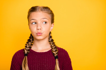 Close-up portrait of her she nice attractive lovely cute girlish pre-teen girl looking aside sending you kiss isolated over bright vivid shine vibrant yellow color background