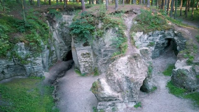 Devil's Oven or Large Ellite Natural Geological Monument  Located in the Gauja National Park at Lode Behind Cesis in Latvia. Licu  Langu Sandstone Cliffs Liepa Cave. Aerial Dron Shoot.