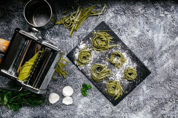  Spinach green pasta on a black slate plate