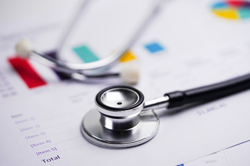 Stethoscope, Charts and Graphs spreadsheet paper, Finance, Account, Statistics, Investment, Analytic research data economy and Business company concept..