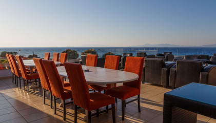 bar on balcony of the resort overlooking the sea, the setting sun, Greece, Europe.