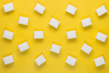 sugar cubes on a yellow background
