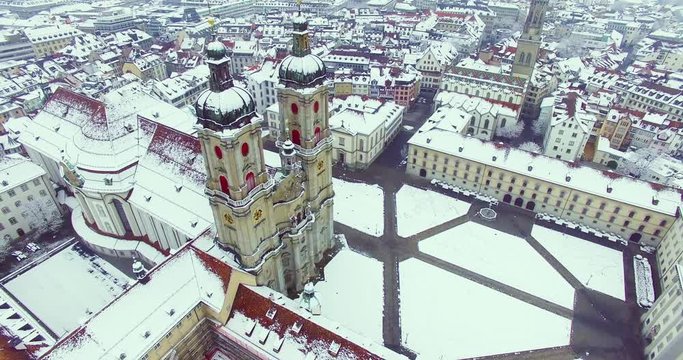St. Gallen, Switzerland - Amazing drone footage of the historical city of Saint Gallen in north Switzerland, with the old town and churches covered in snow.