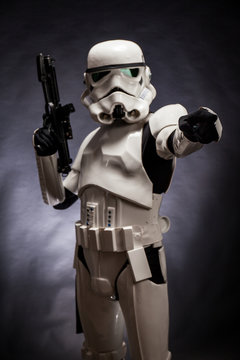 SAN BENEDETTO DEL TRONTO, ITALY. NOVEMBER 11, 2017. Studio portrait  of stormtrooper costume replica, with blaster E-11 gun. He is a fictional character of Star Wars saga. Black background 