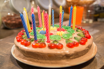 homemade birthday cake with colorful candles