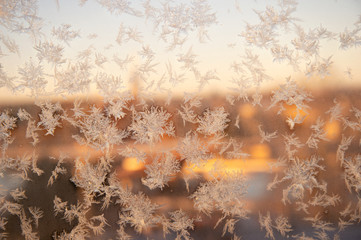 white snowflake on glass transparent window in winter Christmas time