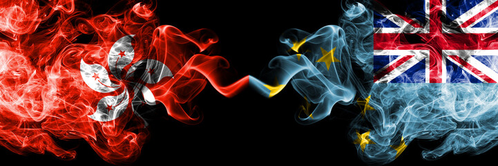 Hong Kong, China vs Tuvalu, Tuvaluan smoky mystic states flags placed side by side. Concept and...