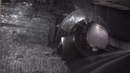 Underground coal mining. The work of the harvester in the longwall.