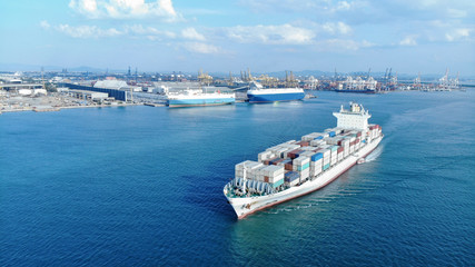 Aerial of white cargo ship carrying container and running for export and import goods  from  cargo...