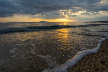 Beautiful dramatic sunrise sea beach landscape. Horiozntal color photography. 
