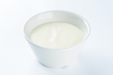 mayonnaise in a bowl on a light background