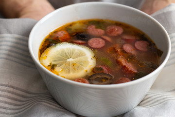hot soup with sausages and vegetables close-up
