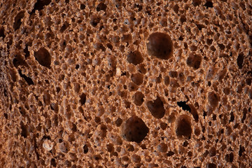 Close up black bread texture. Macro photography. 