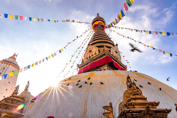 Swayambhunath Stupa, aka The Monkey Temple, during sunrise in Kathmandu, Nepal. A UNESCO Heritage Site. Ancient ruins and stone temples.