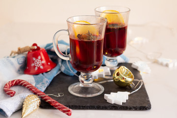 mulled wine of red wine and spices and Christmas decorations on a white background