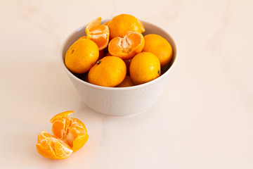 ripe tangerines in a plate on a close-up