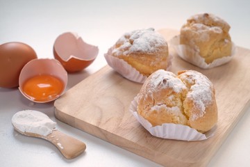 Choux Cream , Chu Cream in wooden tray on white table