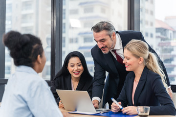 Corporate business team and manager in a meeting.Young team of coworkers making great business discussion in modern coworking office.Teamwork people concept