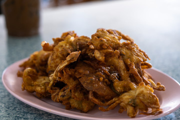 Soft Shell Crab fried with garlic on plate in restaurant.