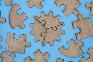  Wooden jigsaw puzzle on a blue background